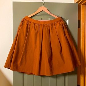 Uniqlo | burnt orange flared midi skirt with hidden pockets | XL